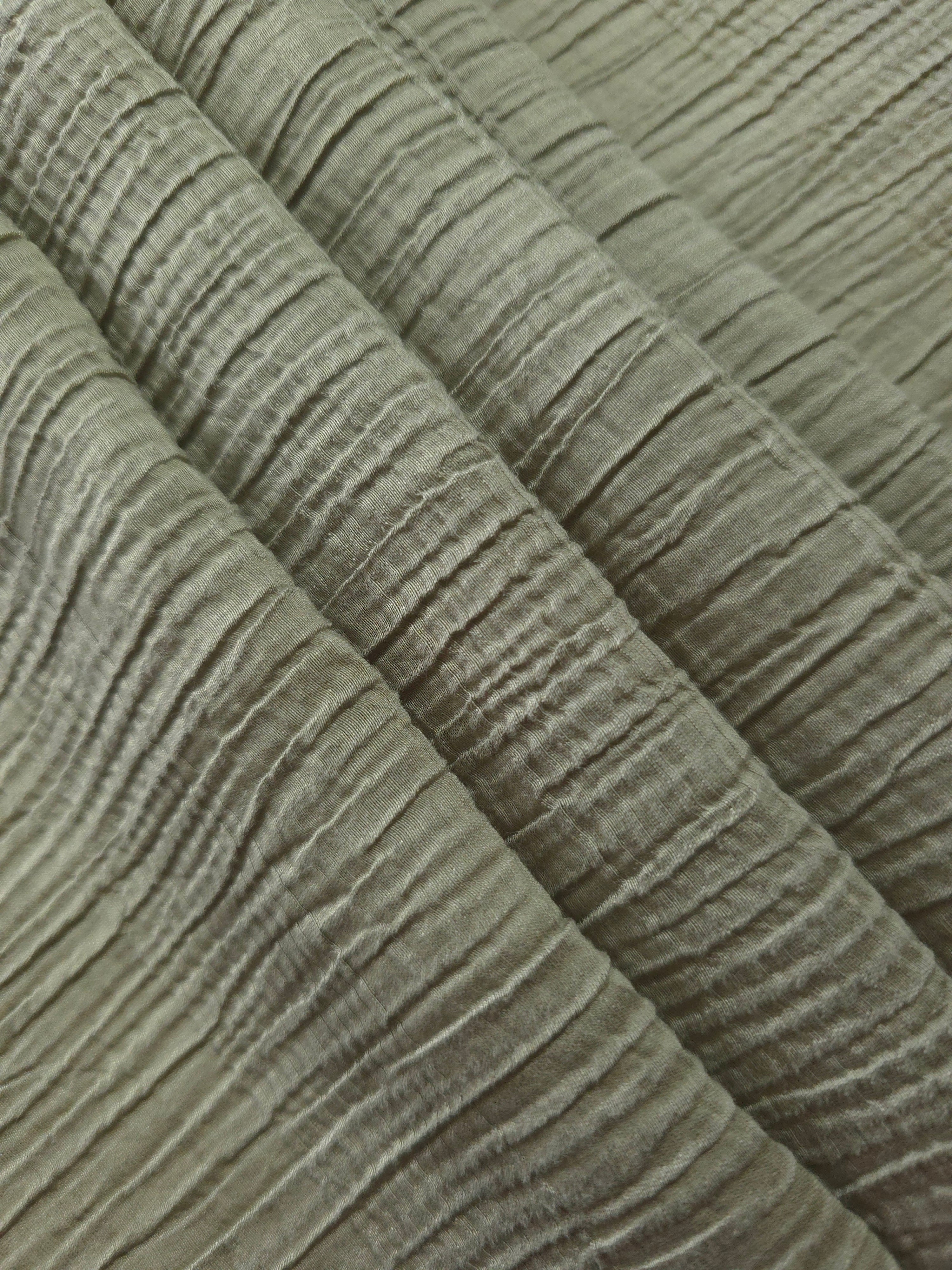 Close-up of Sage Green Tencel jacquard showing tonal stripe texture and light weave.