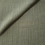 Draped Sage Green Tencel jacquard showing airy movement for kaftans and dresses.