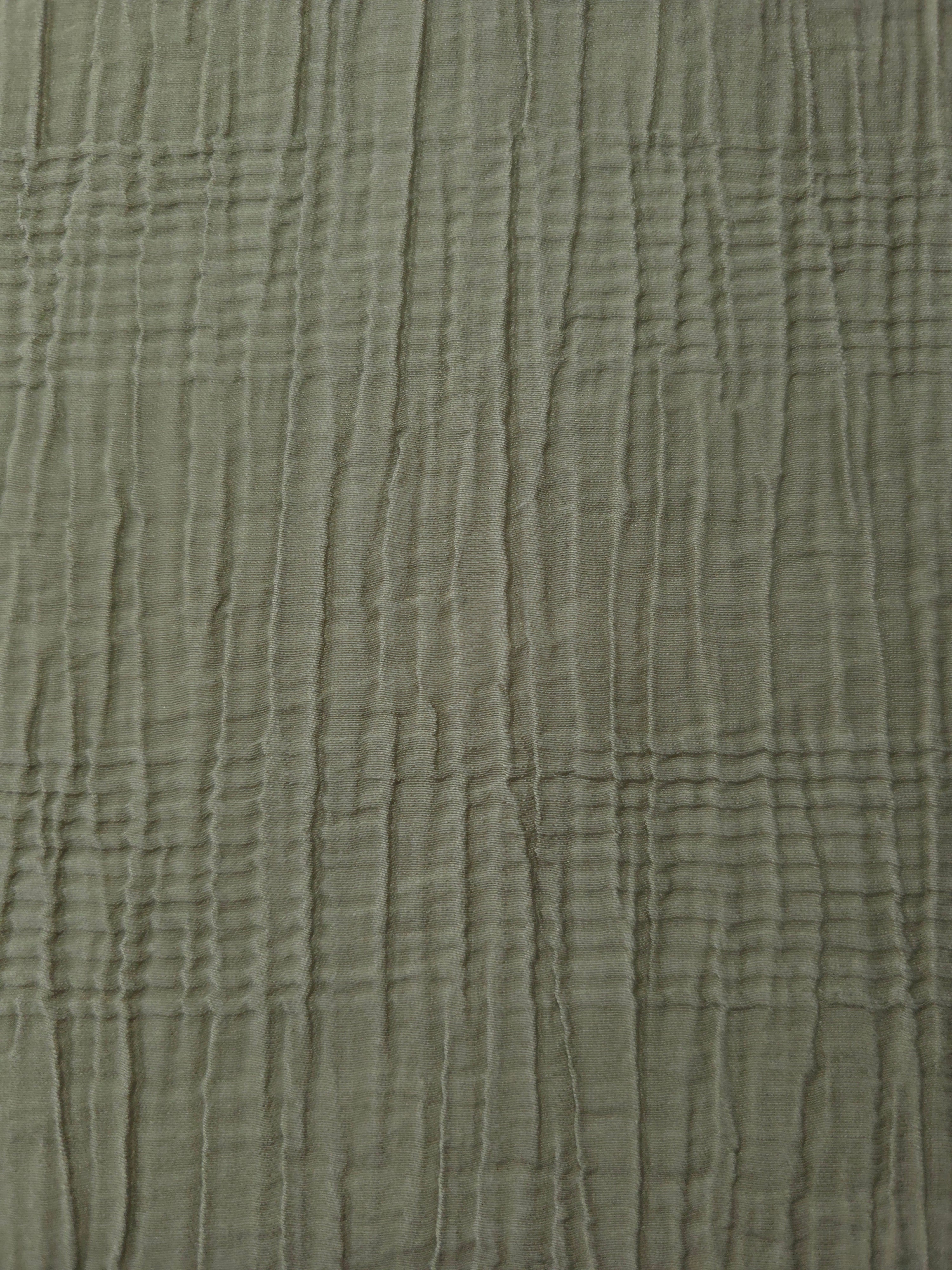 Detail view of Sage Green Tencel jacquard with tonal stripe texture for soft layers.
