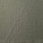 Flat view of Sage Green Tencel jacquard with tonal leaf texture for dresses and layers.