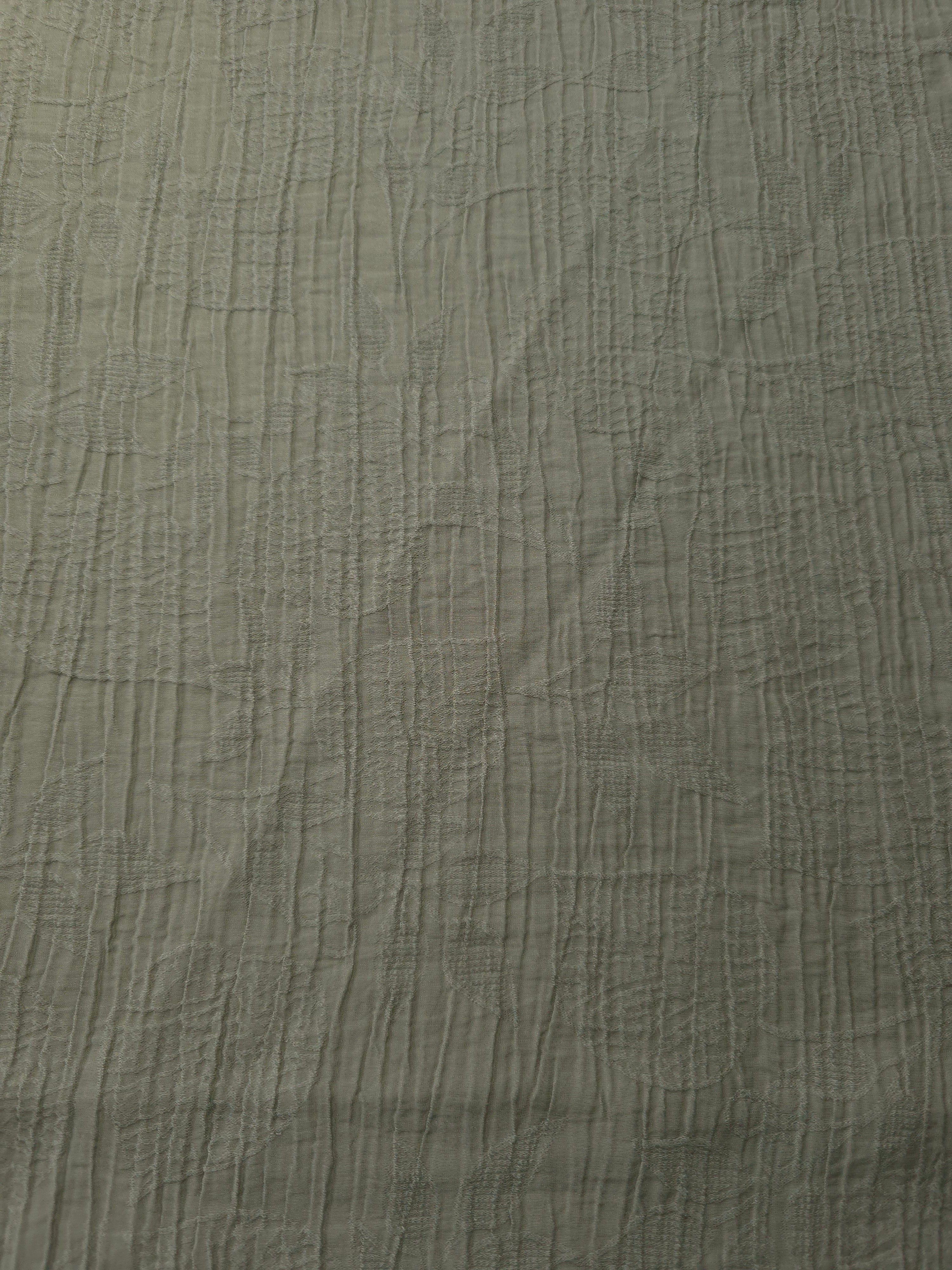 Flat view of Sage Green Tencel jacquard with tonal leaf texture for dresses and layers.