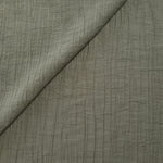 Draped Sage Green Tencel jacquard showing airy movement for kaftans and dresses.