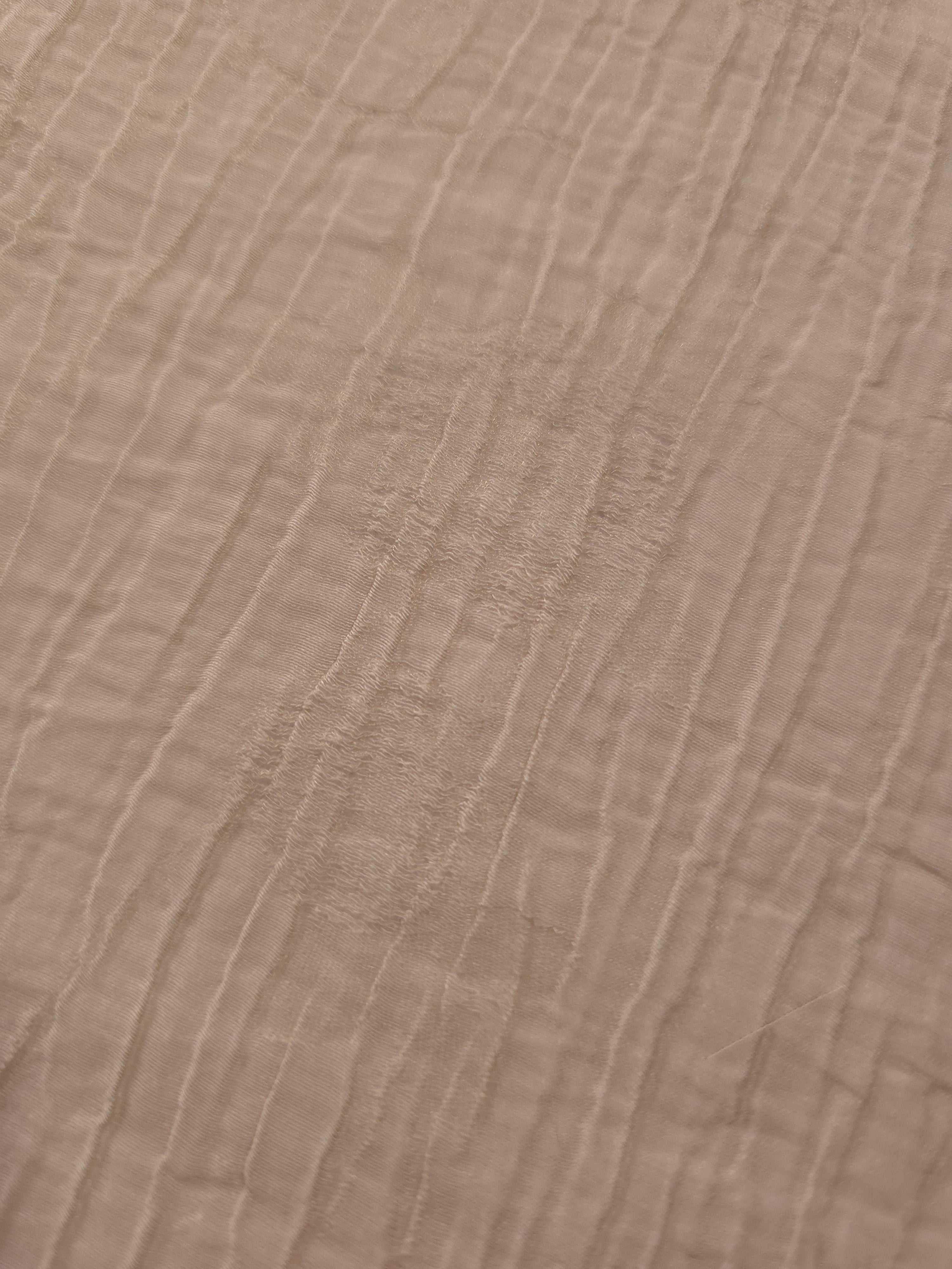 Close-up of Soft Beige Tencel jacquard showing tonal petal texture and light weave.