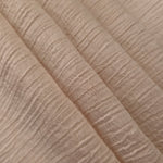 Folded Soft Beige Tencel jacquard with tonal petal texture for blouse and skirt layers.