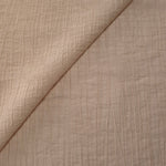 Draped Soft Beige Tencel jacquard showing airy movement for kaftans and dresses.