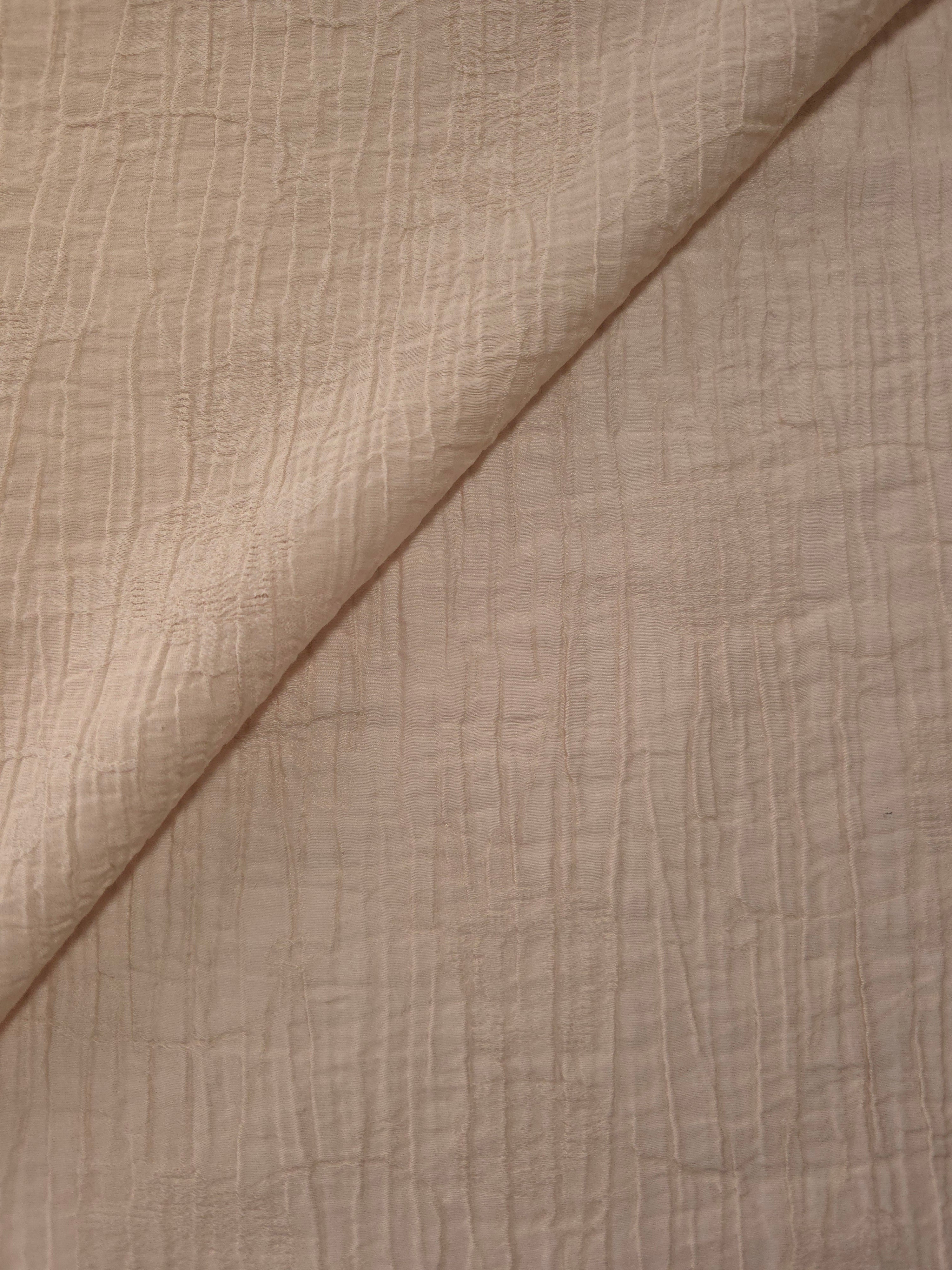 Draped Soft Beige Tencel jacquard showing airy movement for kaftans and dresses.
