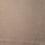 Flat view of Butter Yellow Tencel jacquard with tonal petal texture for dresses and layers.