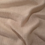 Fold detail of Butter Yellow Tencel jacquard with tonal petal texture for dressmaking.