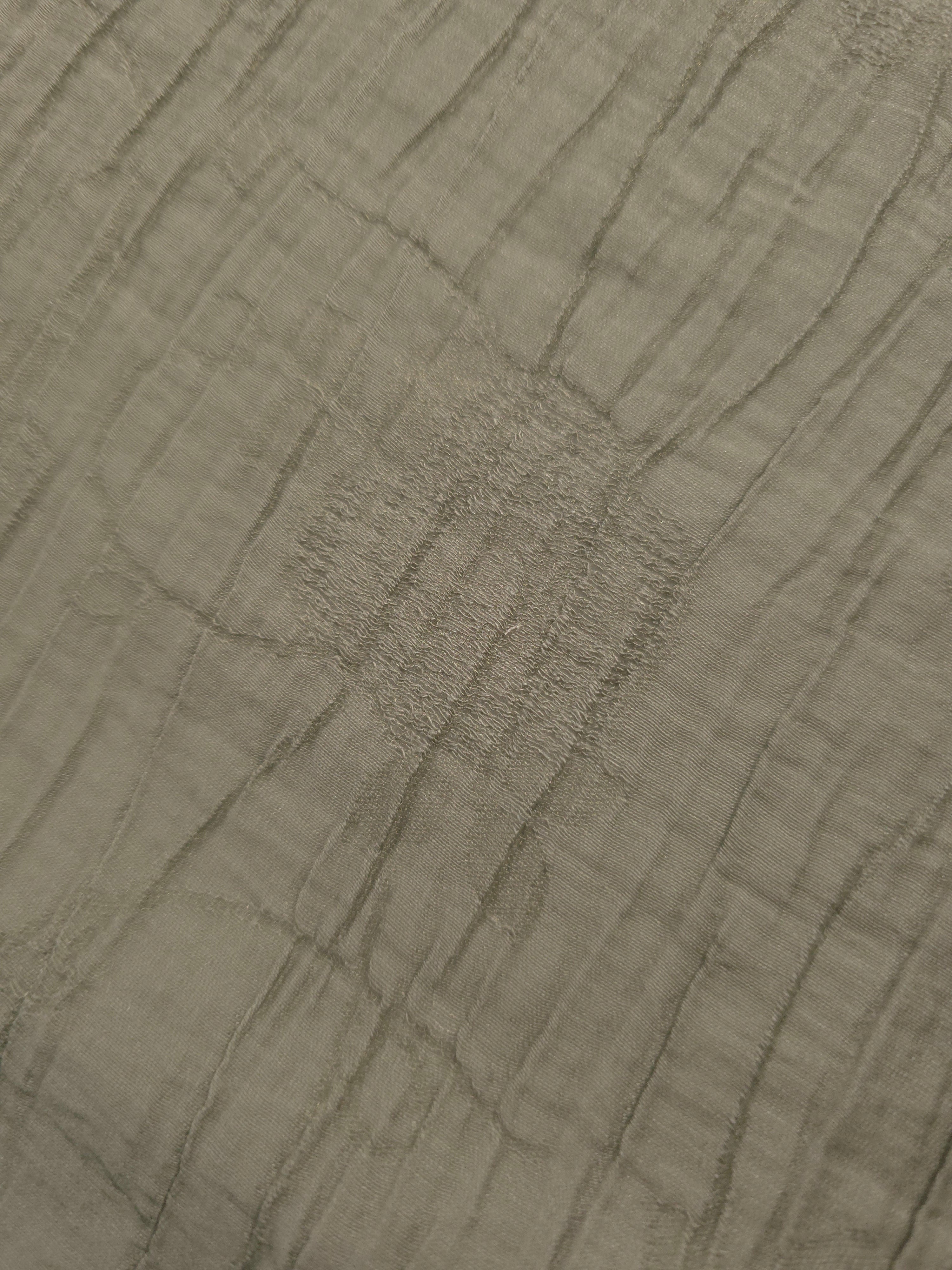 Flat view of Sage Green Tencel jacquard with tonal petal texture for dresses and layers.