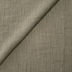 Folded Sage Green Tencel jacquard with tonal petal texture for blouse and skirt layers.