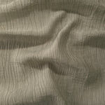 Draped Sage Green Tencel jacquard showing airy movement for kaftans and dresses.