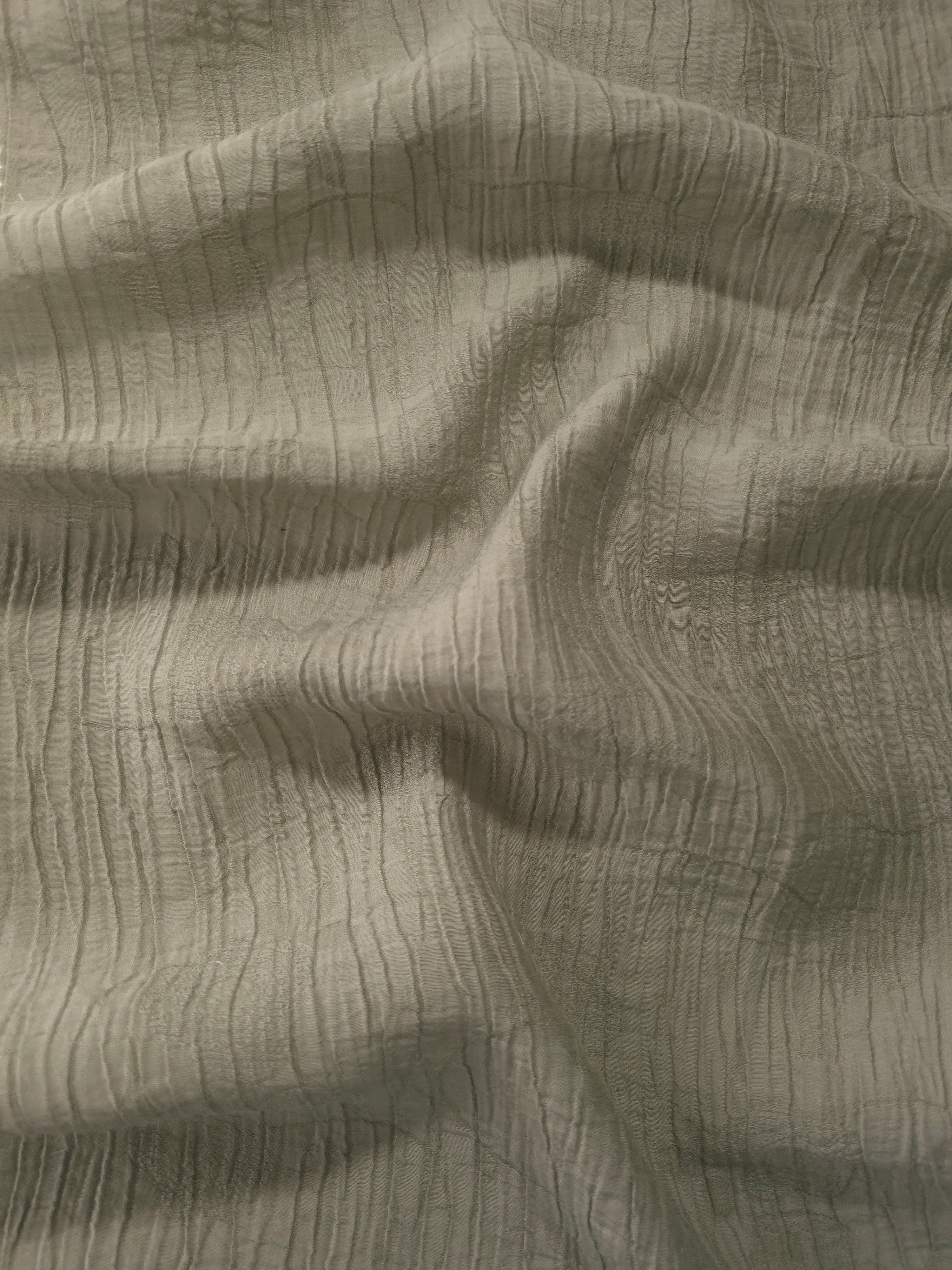 Draped Sage Green Tencel jacquard showing airy movement for kaftans and dresses.