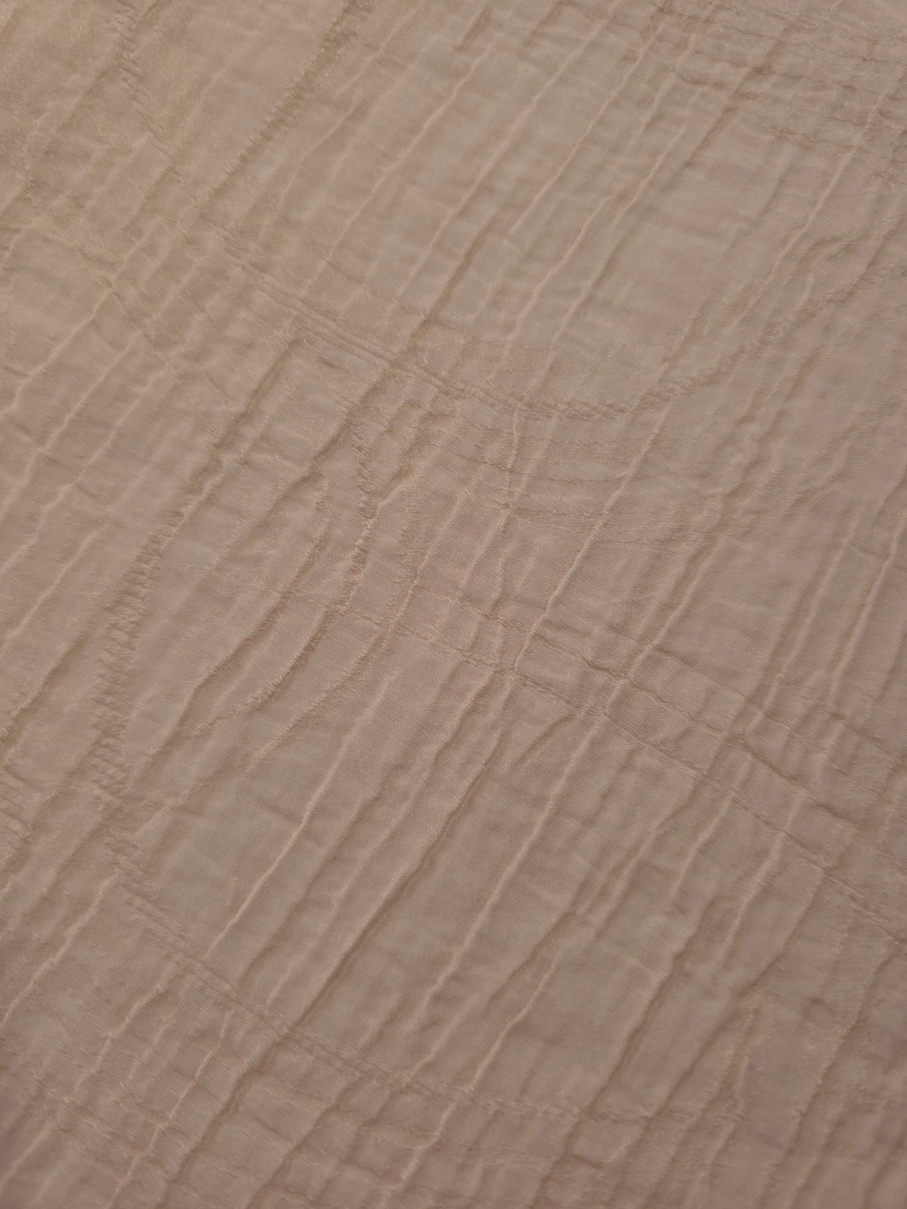 Close-up of Soft Beige Tencel jacquard showing tonal swirl texture and light weave.