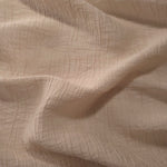 Draped Soft Beige Tencel jacquard showing airy movement for kaftans and dresses.