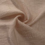 Flowing Soft Beige Tencel jacquard with tonal swirl texture for lined dress layers.