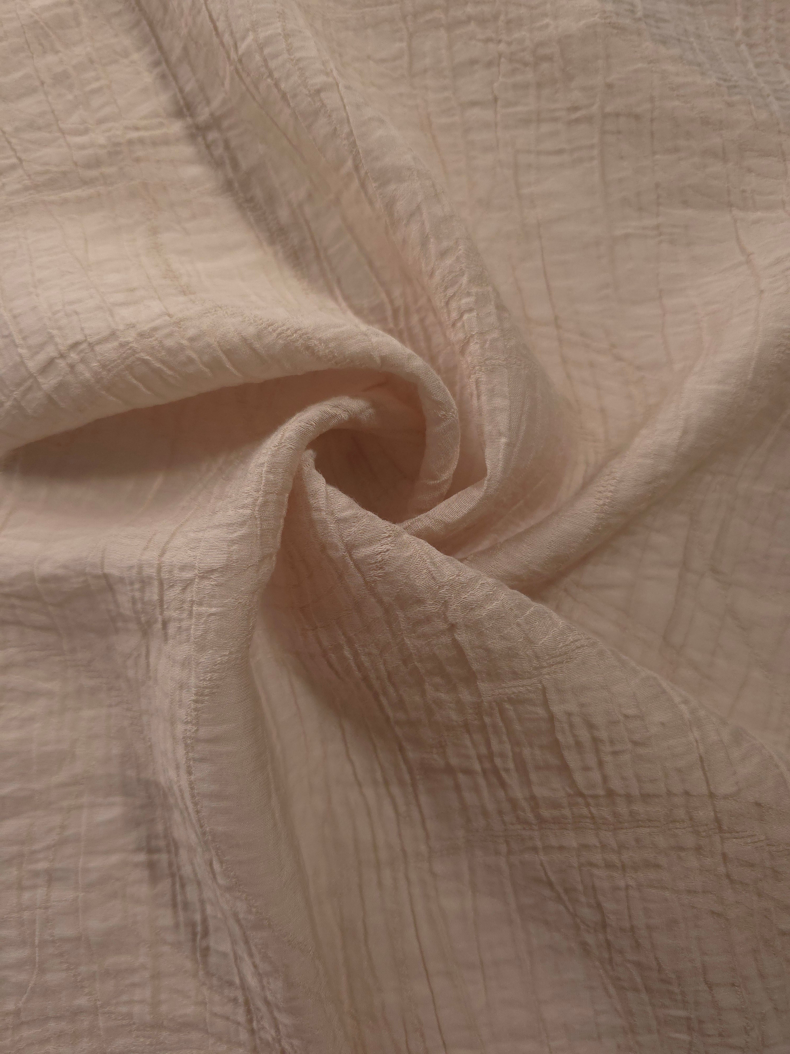 Flowing Soft Beige Tencel jacquard with tonal swirl texture for lined dress layers.