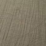 Close-up of Sage Green Tencel jacquard showing tonal swirl texture and light weave.