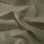 Detail view of Sage Green Tencel jacquard with tonal swirl texture for soft layers.