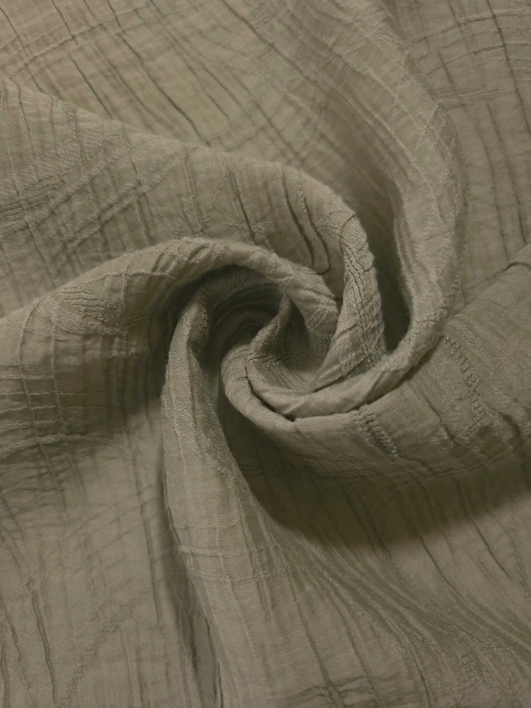 Draped Sage Green Tencel jacquard showing airy movement for kaftans and dresses.