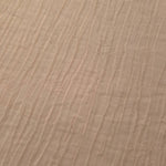 Close-up of Soft Beige Tencel jacquard showing fine root line texture and light weave.