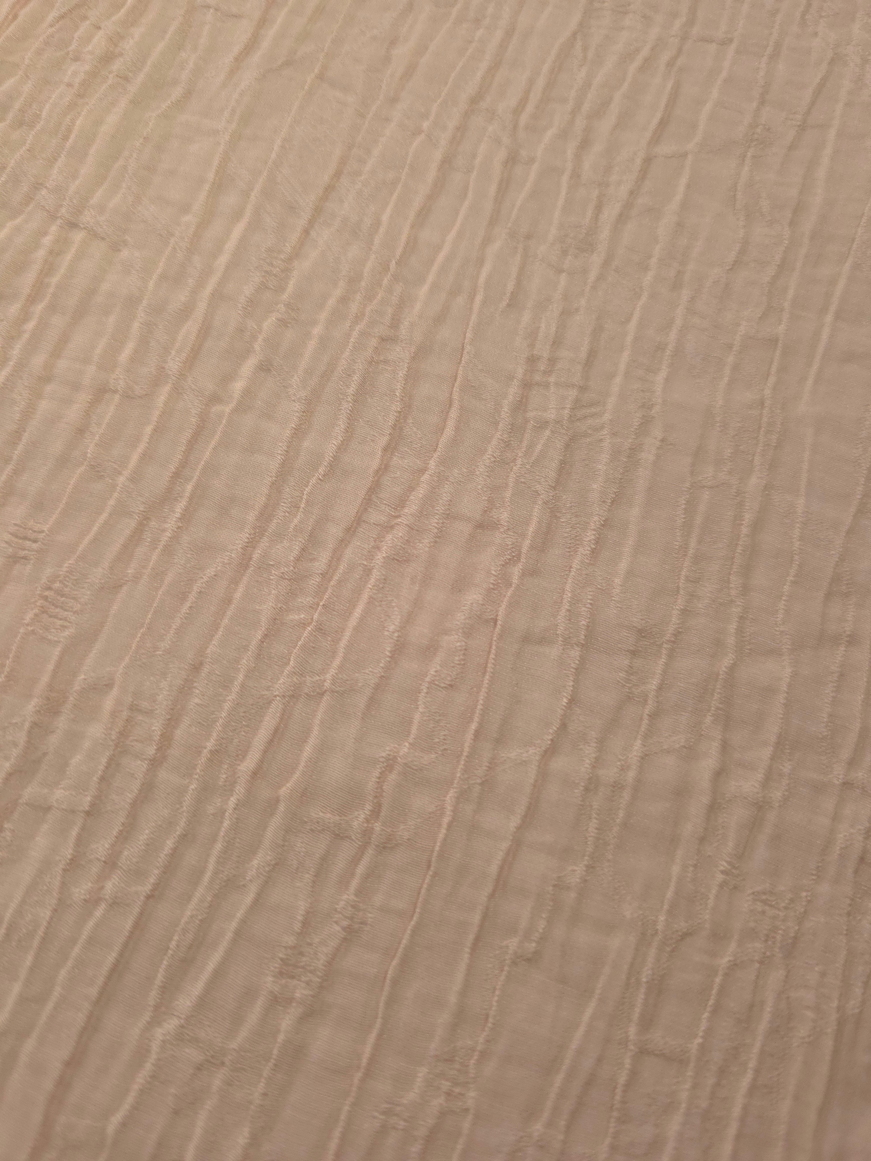 Close-up of Soft Beige Tencel jacquard showing fine root line texture and light weave.