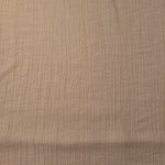 Draped Soft Beige Tencel jacquard showing airy movement for kaftans and dresses.
