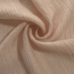 Folded Soft Beige Tencel jacquard with fine root line texture for blouse and skirt layers.