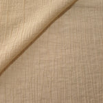Folded Butter Yellow Tencel jacquard with fine root line texture for blouse and skirt layers.