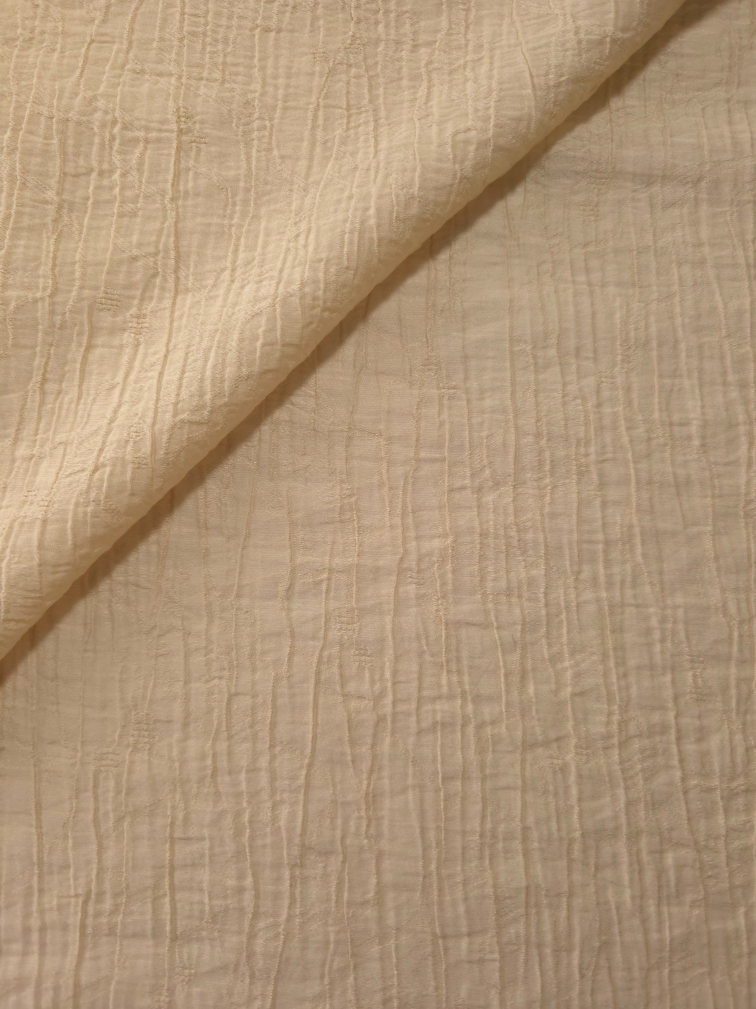 Folded Butter Yellow Tencel jacquard with fine root line texture for blouse and skirt layers.