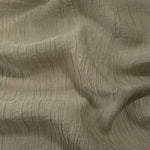 Detail view of Sage Green Tencel jacquard with fine root line texture for soft layers.