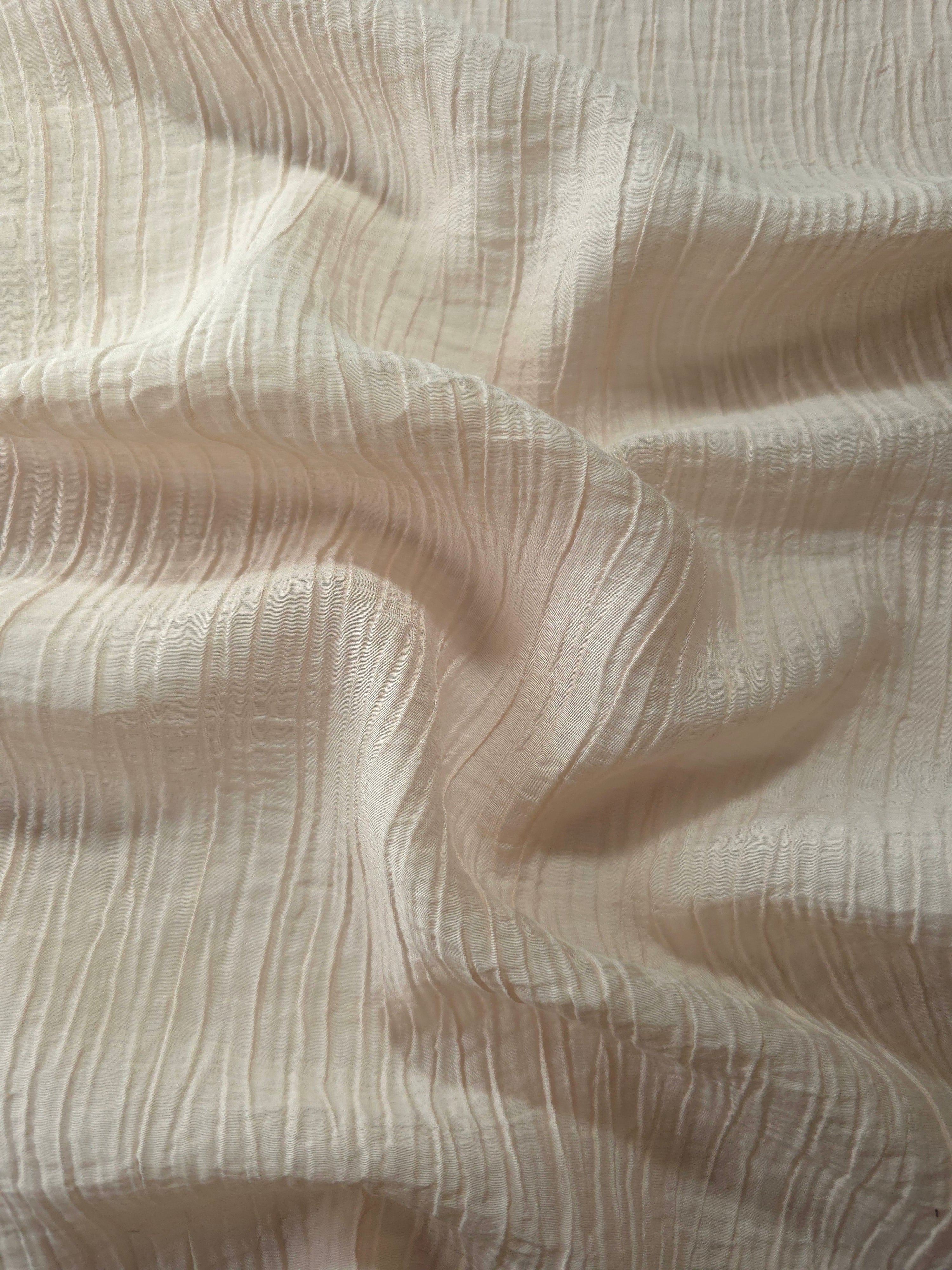 Draped Soft Beige Tencel jacquard showing airy movement for kaftans and dresses.
