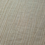 Detail view of Soft Beige Tencel jacquard with subtle woven texture for soft layers.
