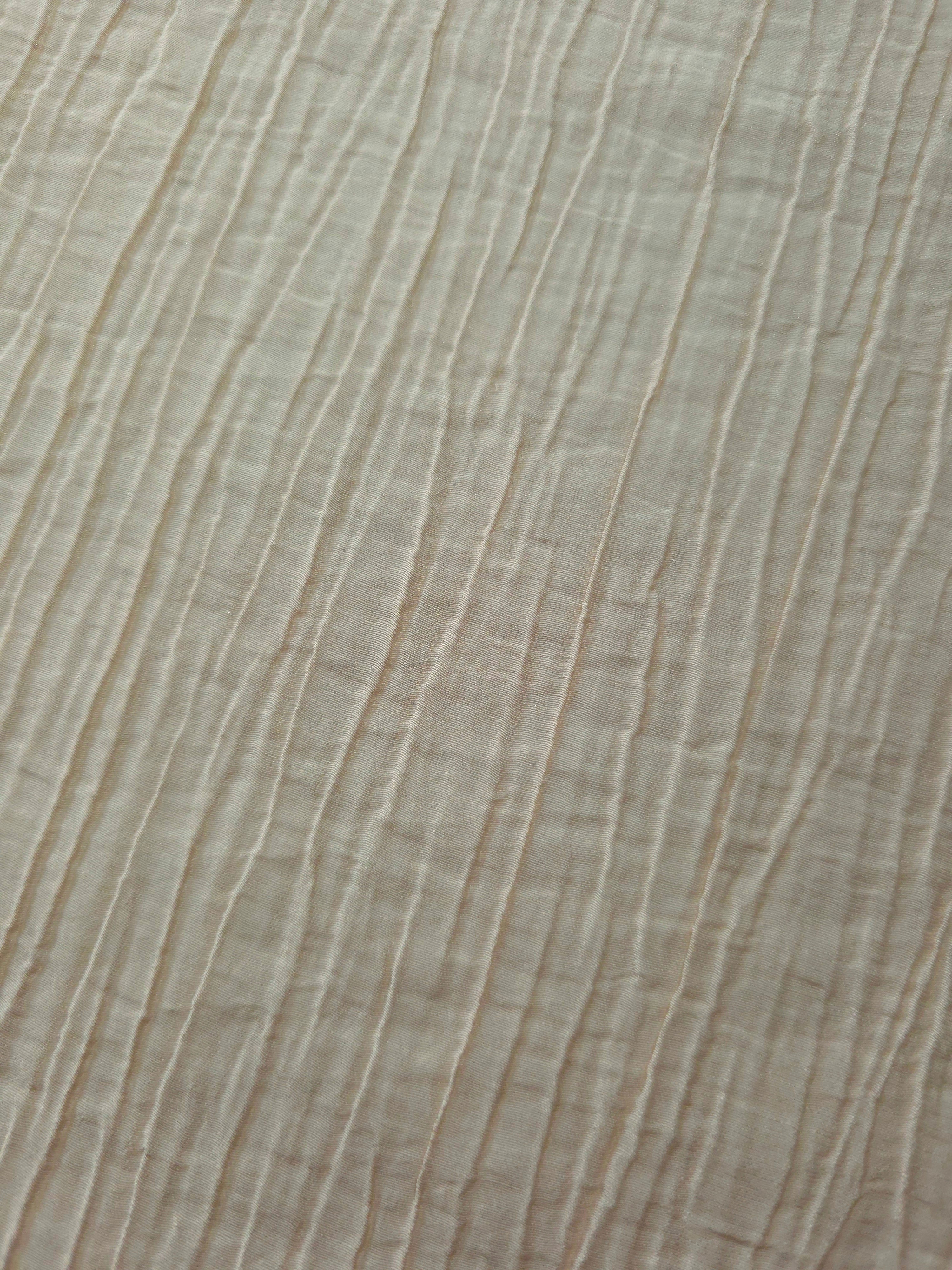 Detail view of Soft Beige Tencel jacquard with subtle woven texture for soft layers.