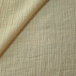 Flat view of Butter Yellow Tencel jacquard with subtle woven texture for dresses and layers.