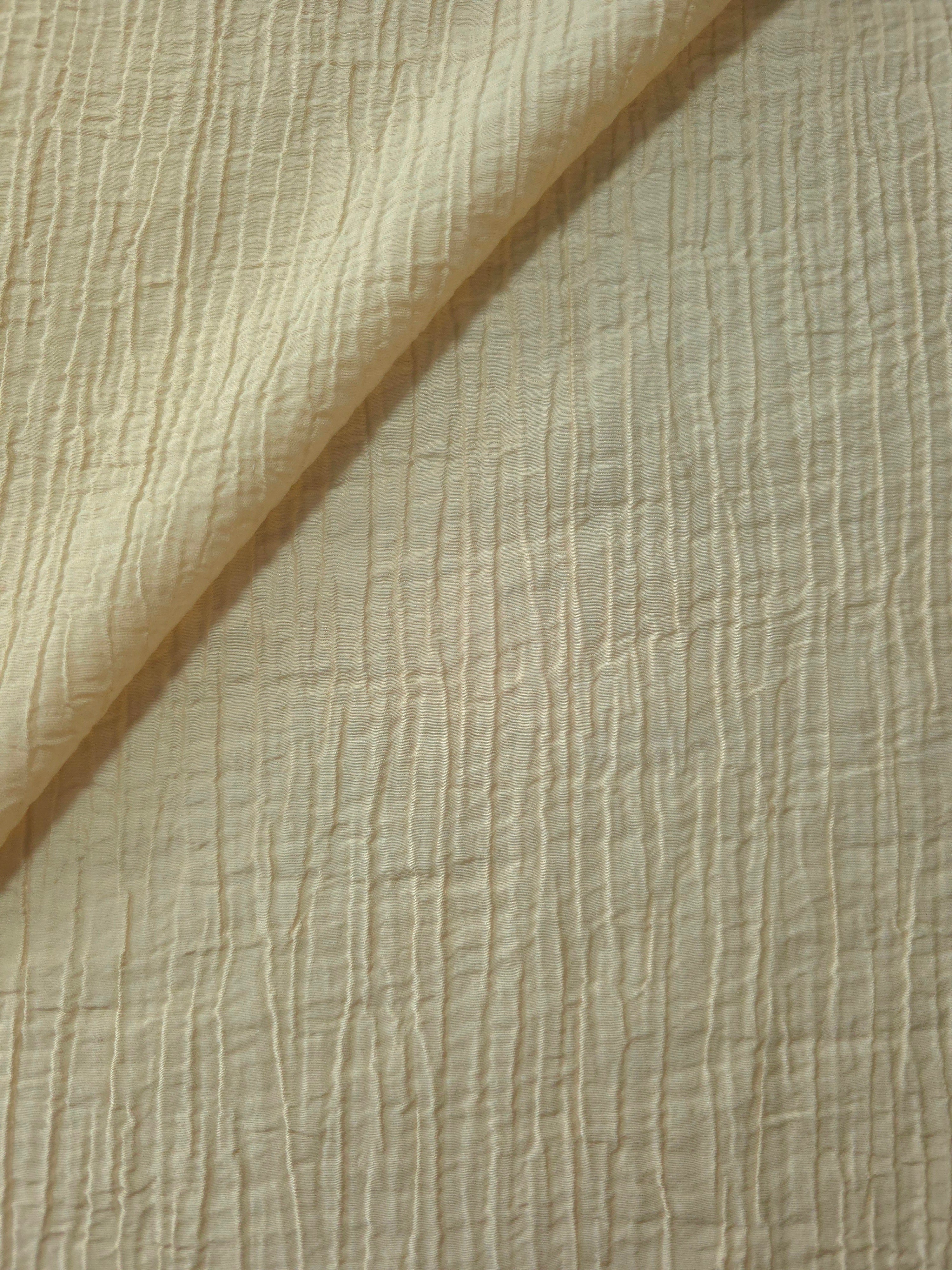Flat view of Butter Yellow Tencel jacquard with subtle woven texture for dresses and layers.
