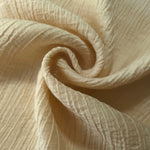 Folded Butter Yellow Tencel jacquard with subtle woven texture for blouse and skirt layers.