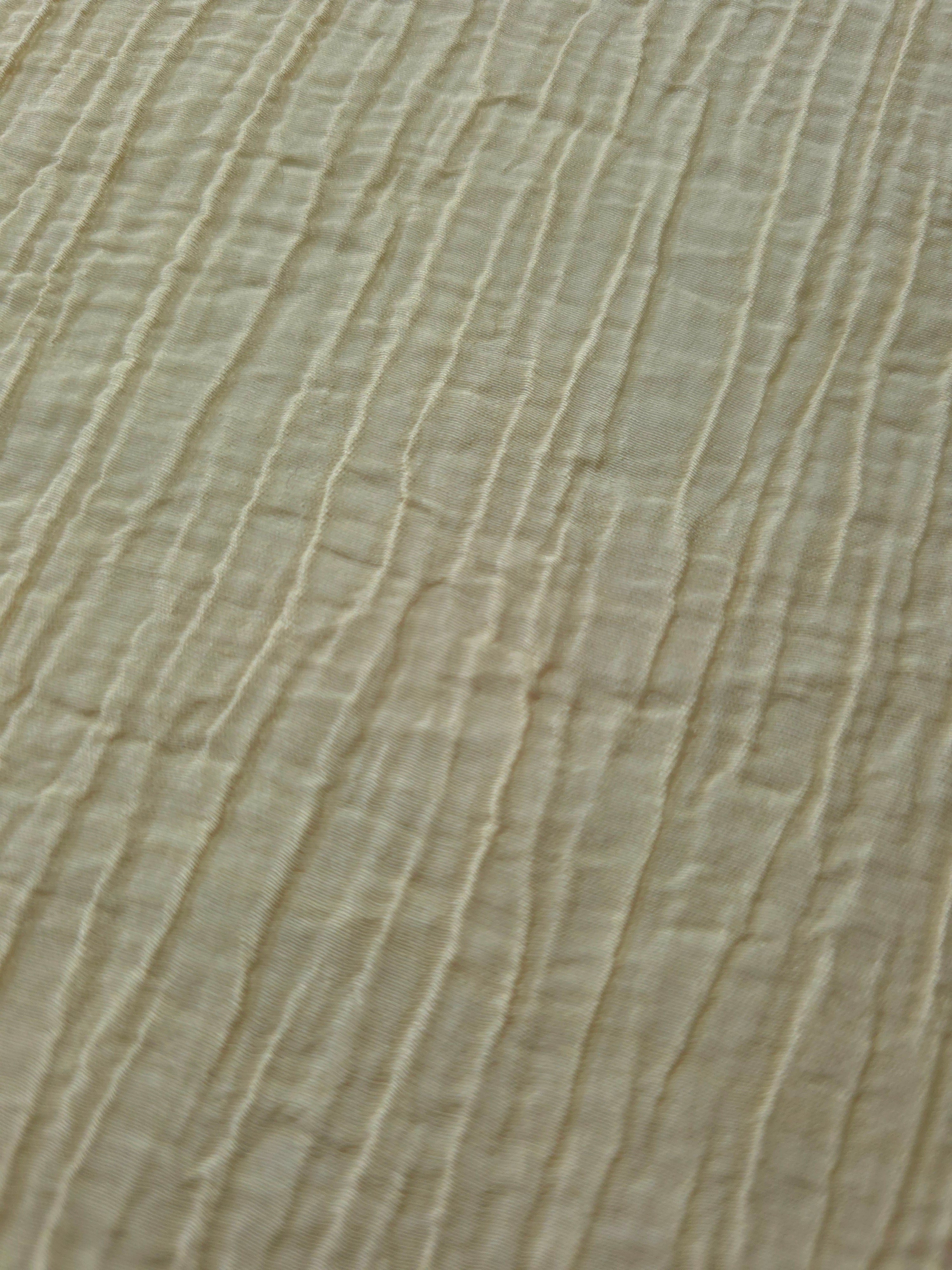 Draped Butter Yellow Tencel jacquard showing airy movement for kaftans and dresses.