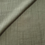 Flat view of Sage Green Tencel jacquard with subtle woven texture for dresses and layers.