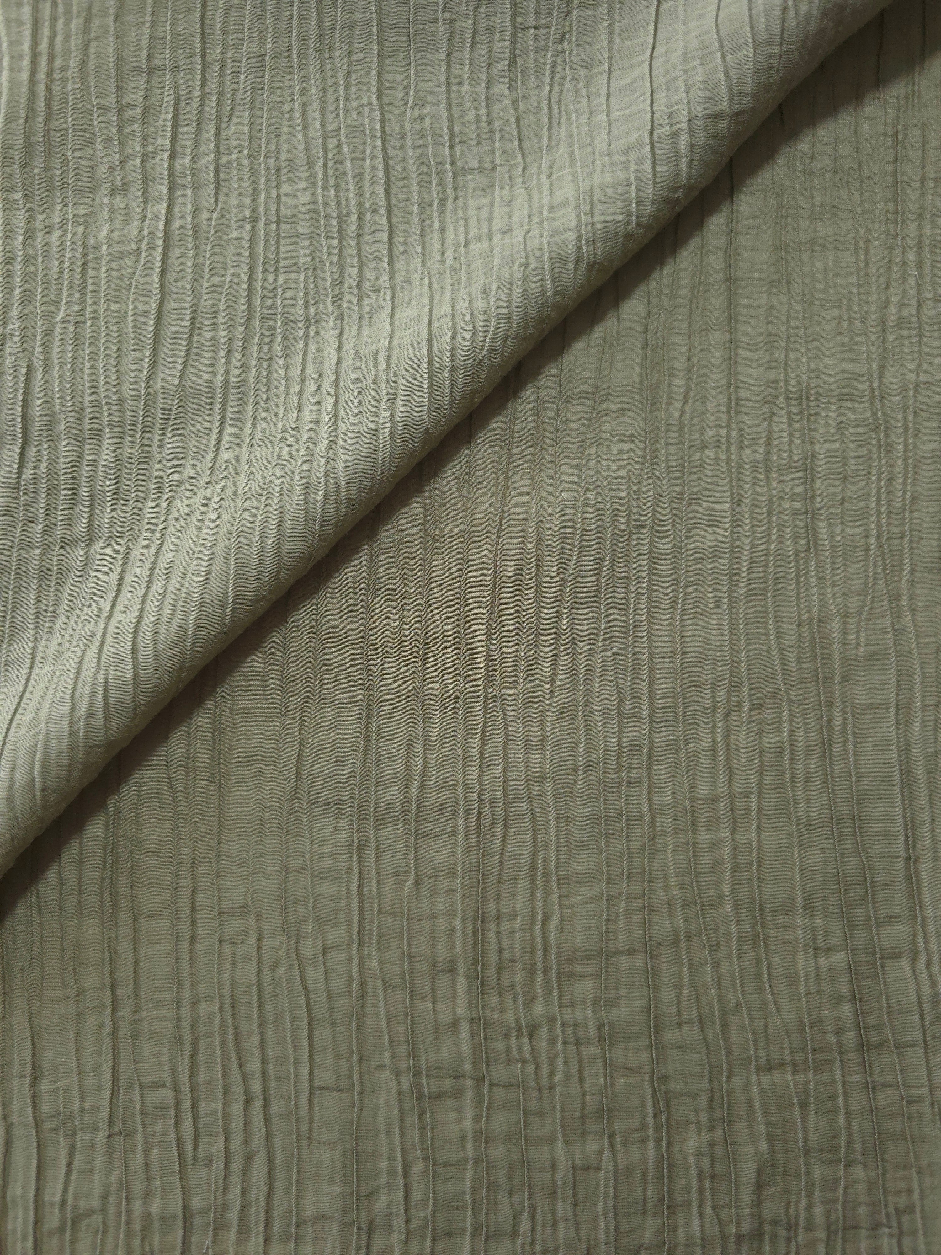 Flat view of Sage Green Tencel jacquard with subtle woven texture for dresses and layers.