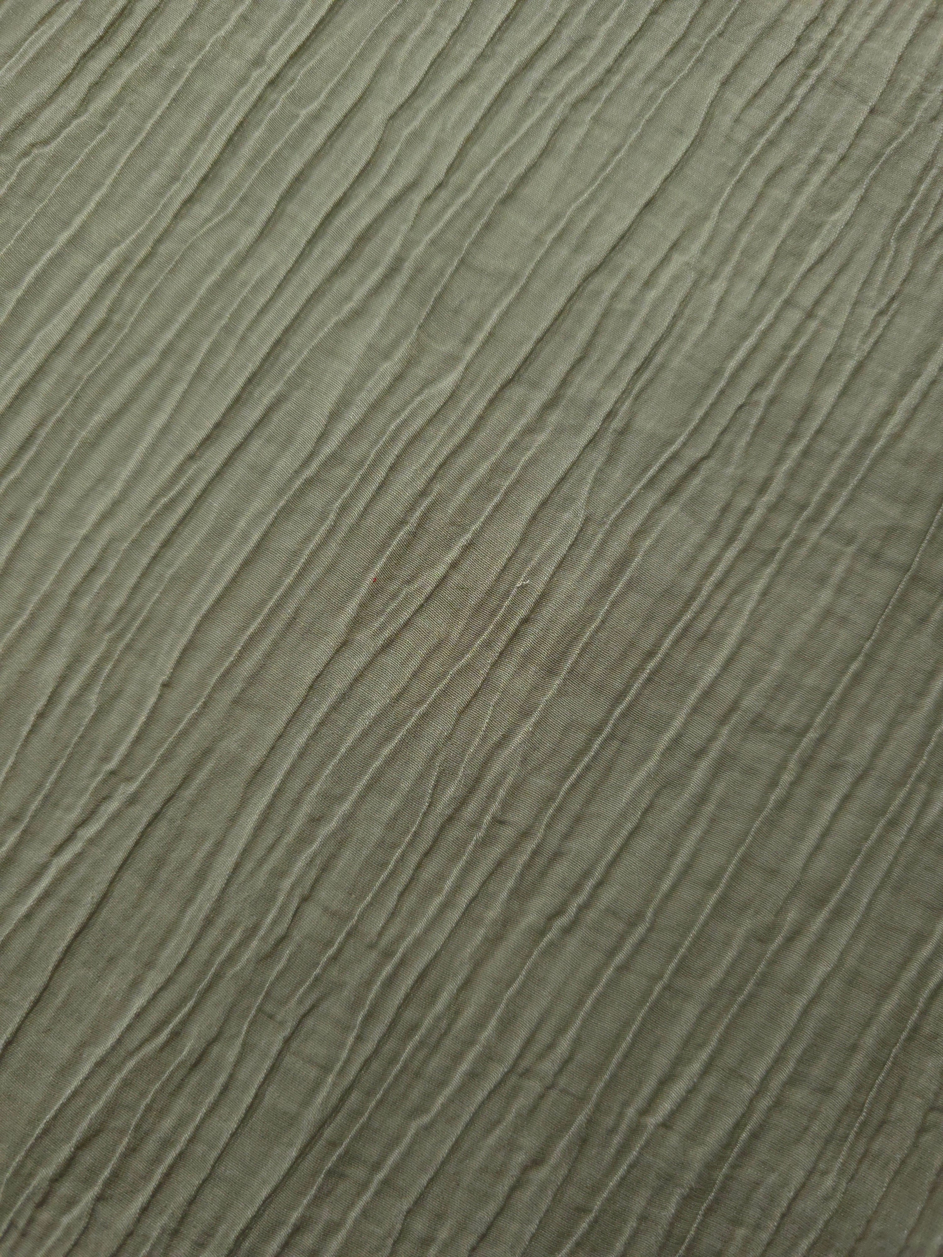 Draped Sage Green Tencel jacquard showing airy movement for kaftans and dresses.