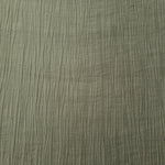 Detail view of Sage Green Tencel jacquard with subtle woven texture for soft layers.