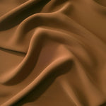 Draped Toffee Brown Korean polyester crepe showing opaque fluid folds for evening dresses and occasionwear