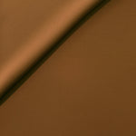 Toffee Brown Korean polyester crepe in a soft fold, showing fluid drape for blouses and flowing dresses