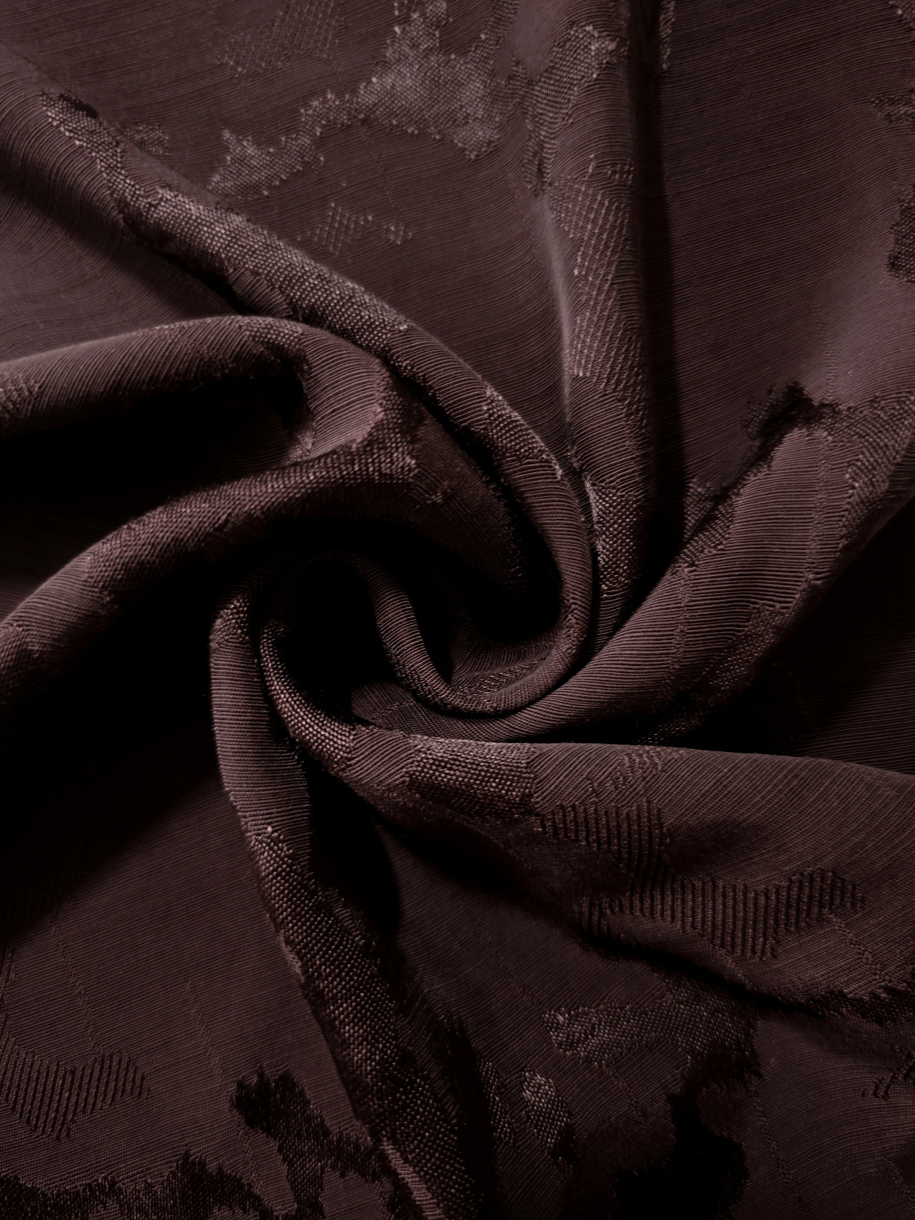 Wine burgundy rayon jacquard gathered to reveal softness and volume for puff sleeves, gathered gowns and flowing occasionwear.