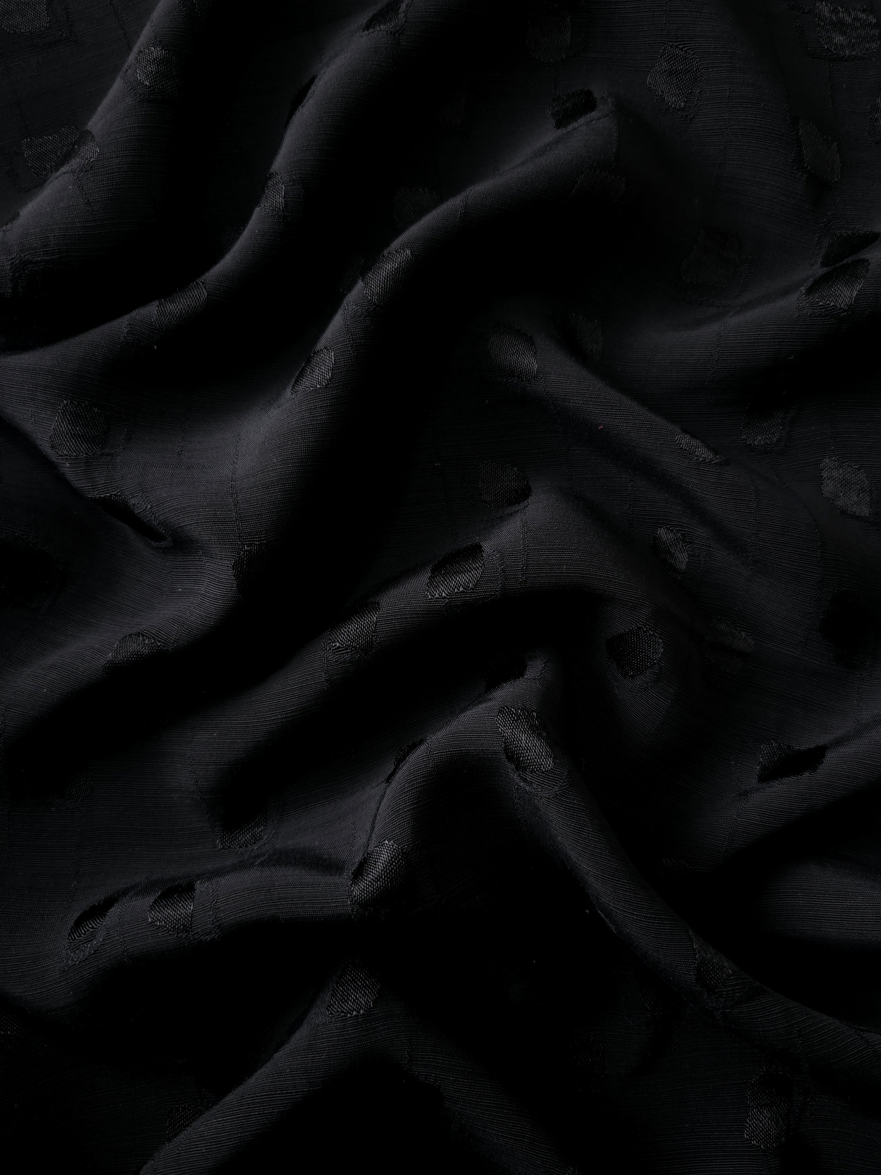 Gathered jet black scattered square viscose rayon jacquard showing fluid volume for abayas, gathered skirts and draped occasion dresses.