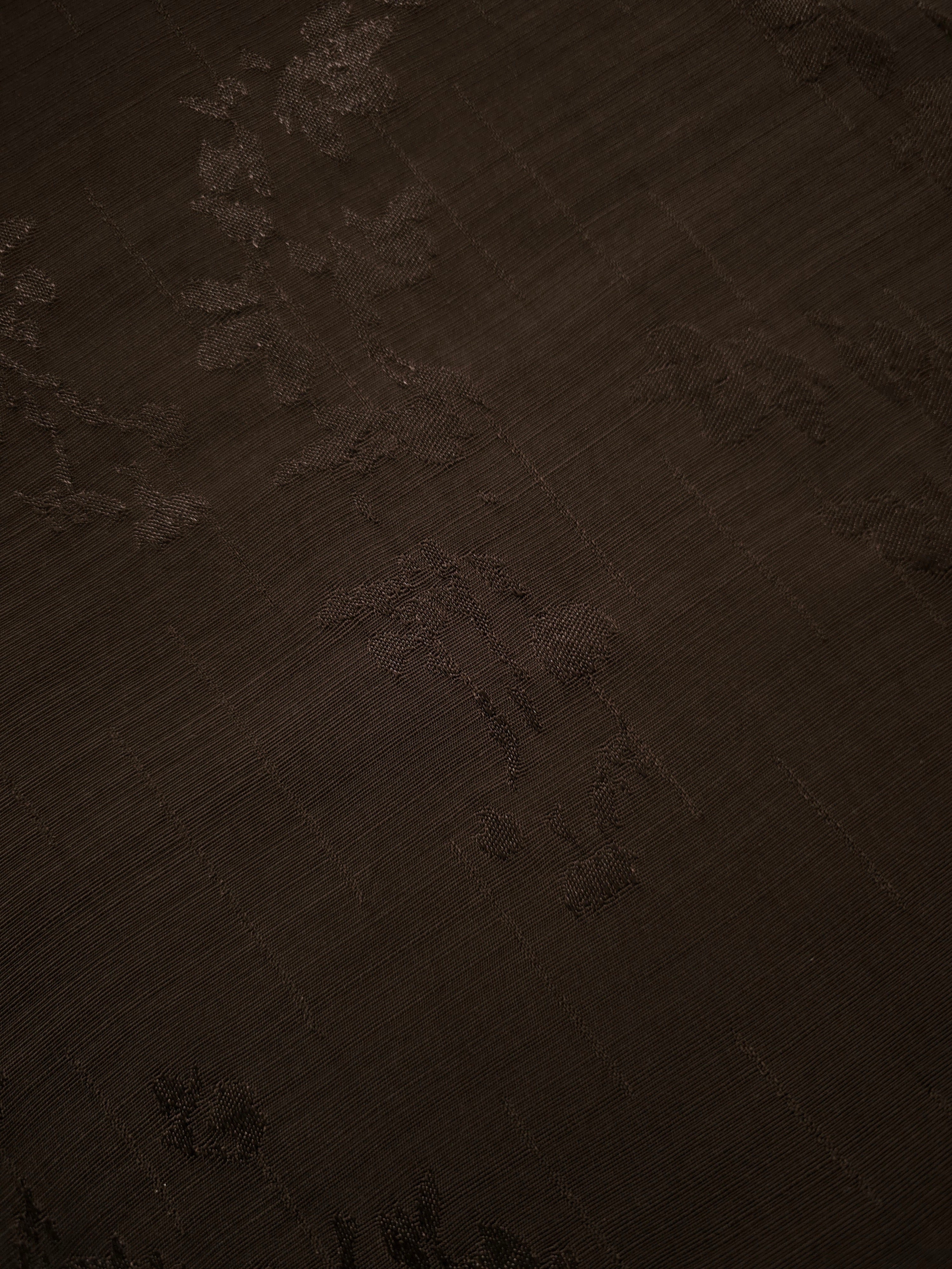 Close-up of espresso brown trailing rose jacquard texture, suited to refined shirts, evening tops and lightweight dressmaking projects.