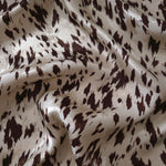 Coffee brown animal print Turkish rayon viscose jacquard fabric in a wave drape