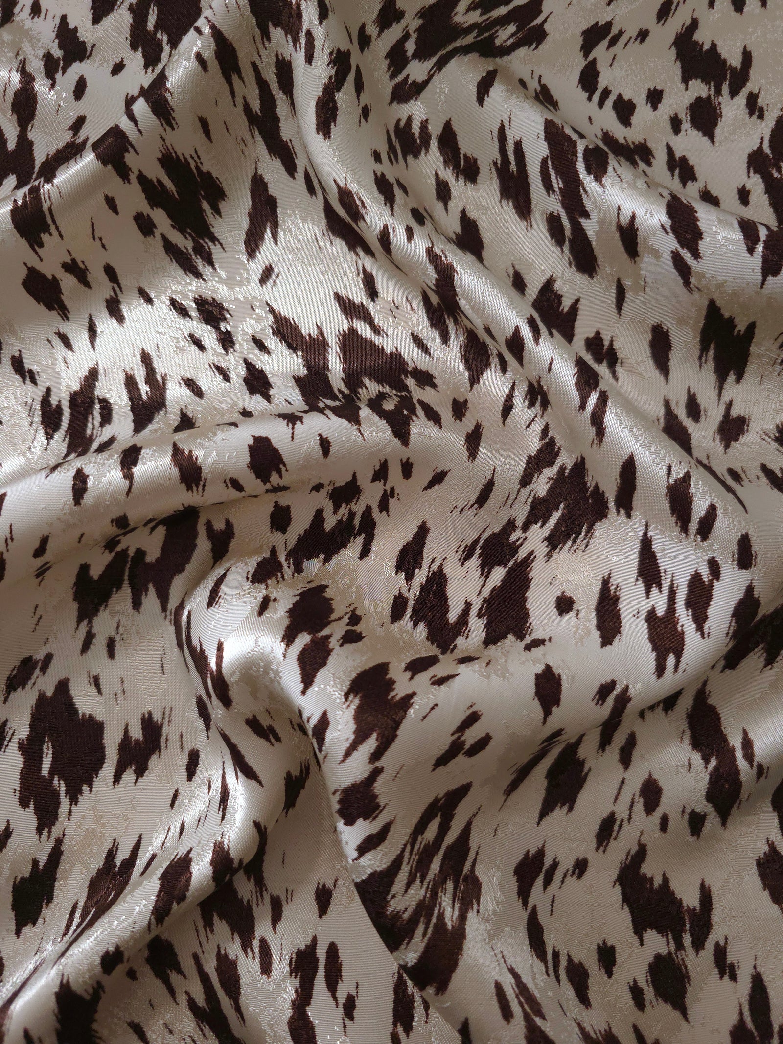 Coffee brown animal print Turkish rayon viscose jacquard fabric in a wave drape