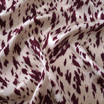 Burgundy animal print Turkish rayon viscose jacquard fabric in a wave drape