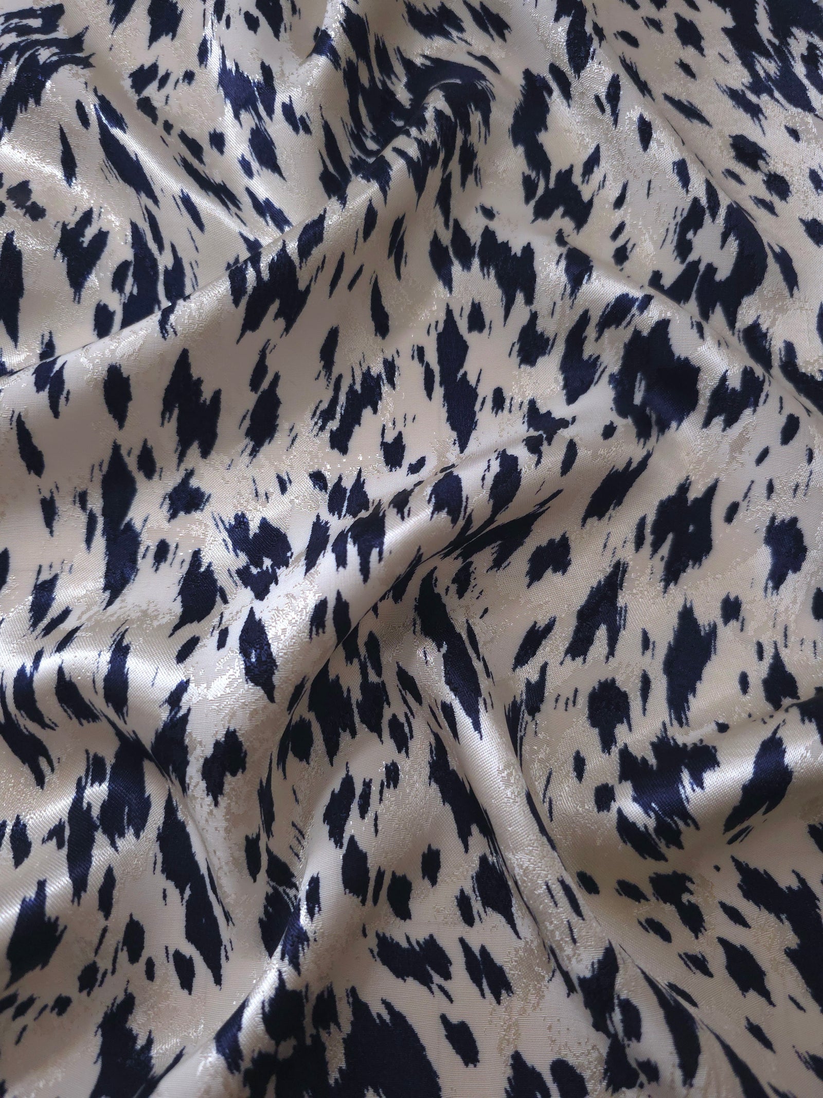 Navy blue animal print Turkish rayon viscose jacquard fabric in a wave drape